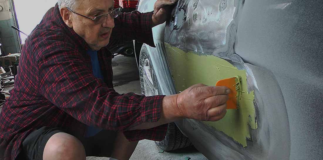 The original Definis State Auto Body shop front on Torresdale Avenue, founded by Gus Definis in 1964